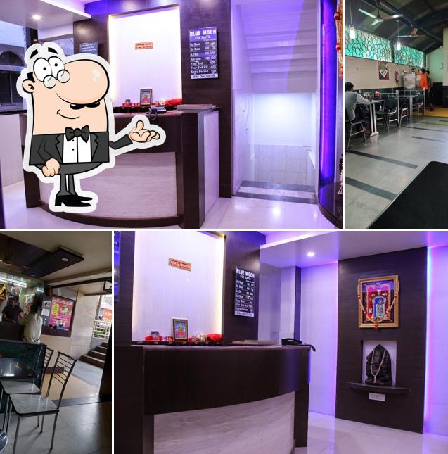 Take a seat at one of the tables at Hotel Radhika