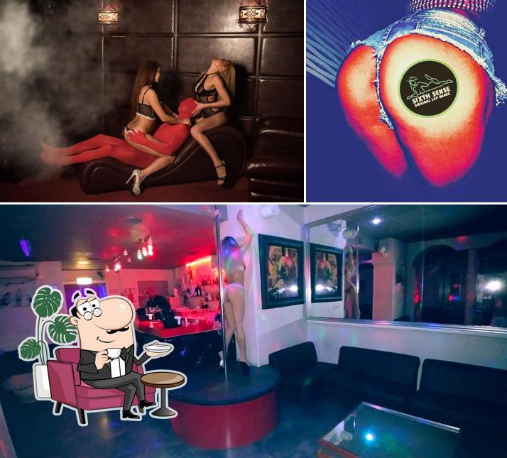 La immagine di interni e cibo da Lapdance Sixth Sense (con body sushi)