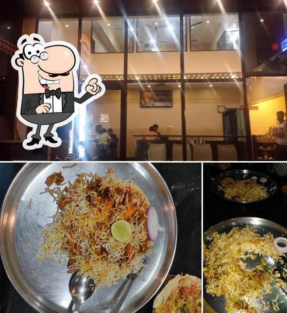 Take a seat at one of the tables at Hyderabad Biryani Paradise