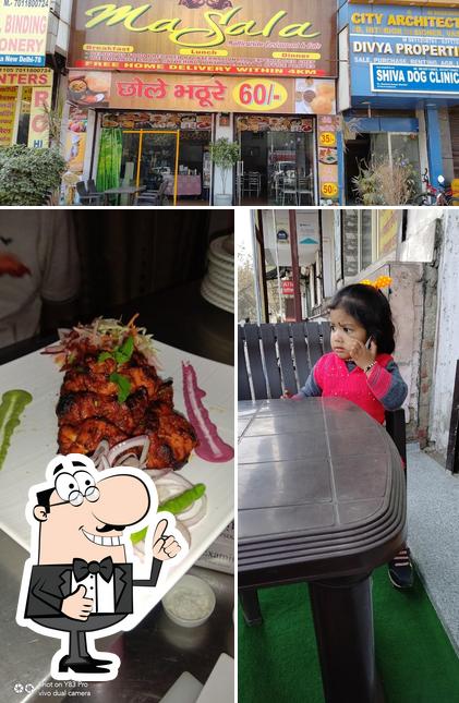 Look at the picture of The Grand Masala Restaurant