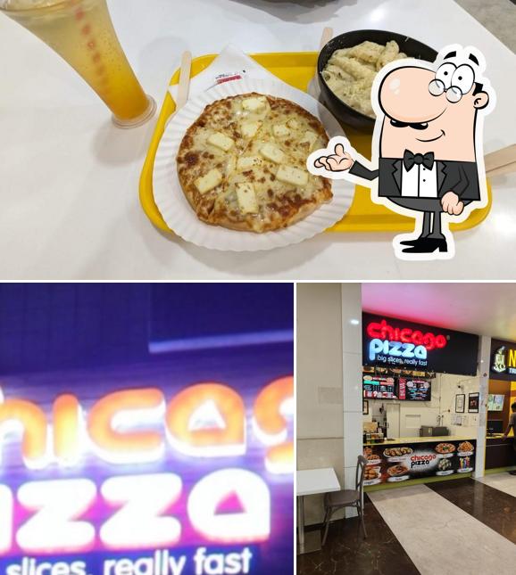 This is the photo depicting interior and food at Chicago Pizza