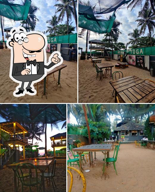 Take a seat at one of the tables at KALIYUGA Toddy Cafe