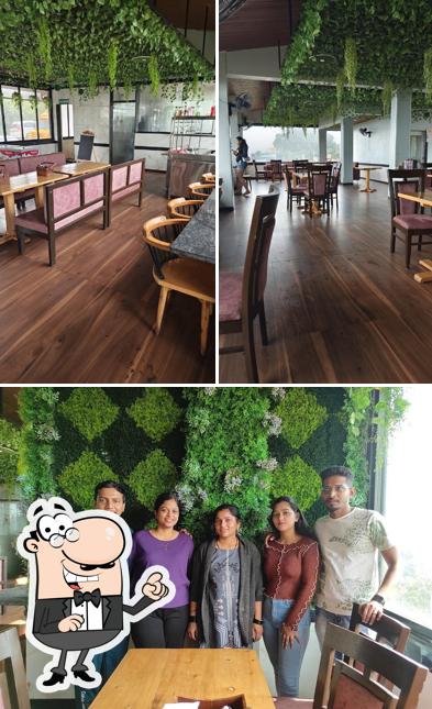 Take a seat at one of the tables at Ginger Cafe Mahabaleshwar