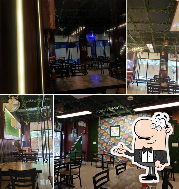 Take a seat at one of the tables at White Hart Pizza