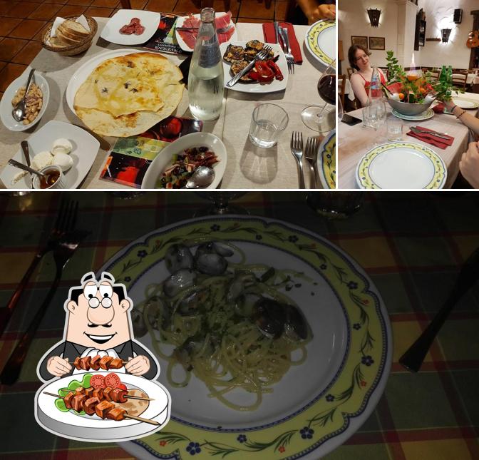 La immagine della cibo e tavolo da pranzo di La Taverna Dei Briganti