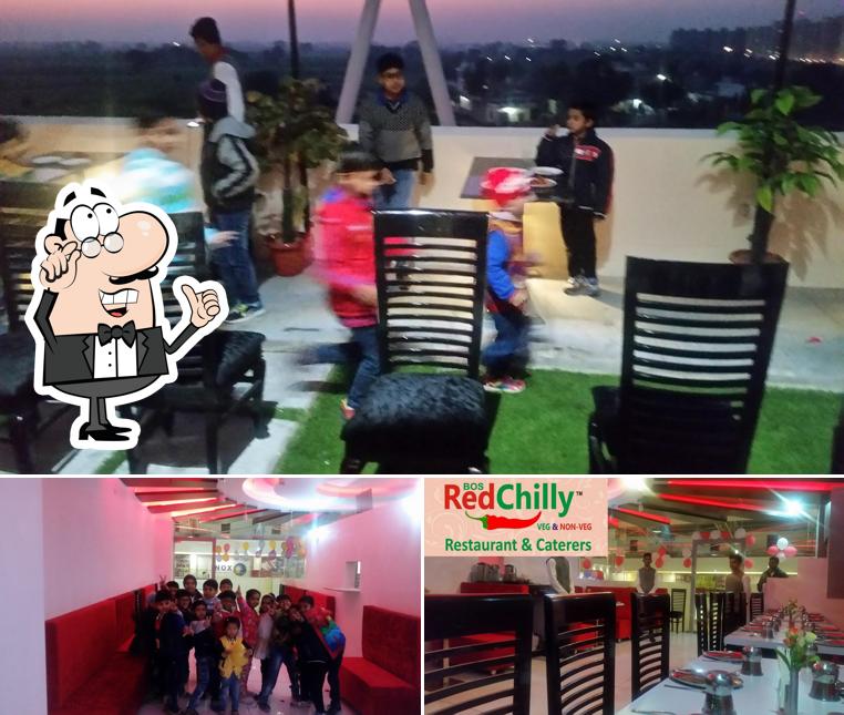 Among different things one can find interior and food at Red Chilly Restaurant & Caterers