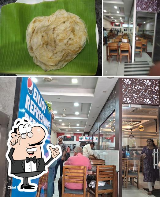The photo of interior and food at Statue Restaurant