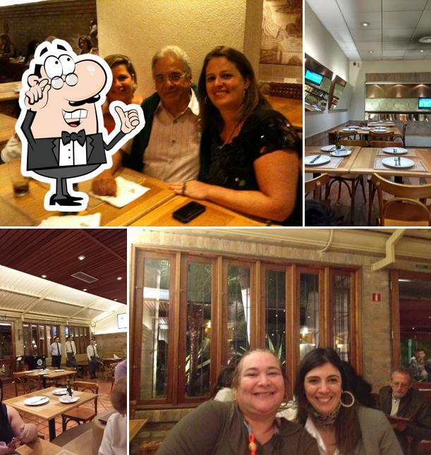 Sente em uma das mesas no Pizzaria Camelo