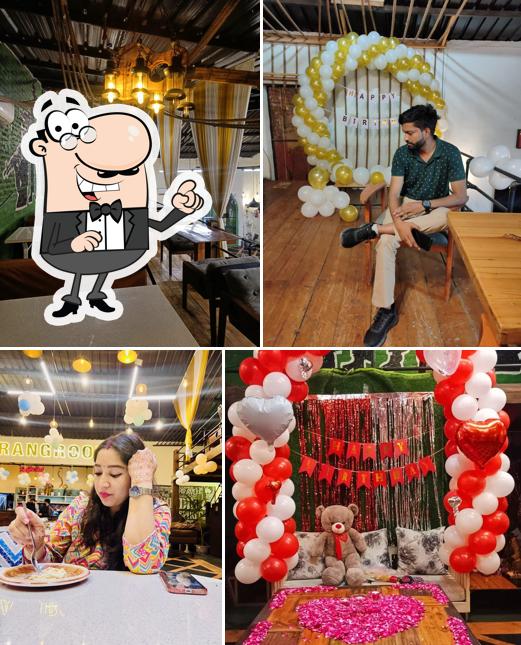 Take a seat at one of the tables at The RangRoot Restro & Cafe Best Restaurant in Meerut Best Restaurant on Meerut Highway