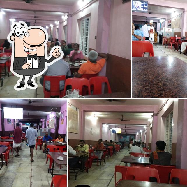 Take a seat at one of the tables at Indian Coffee House