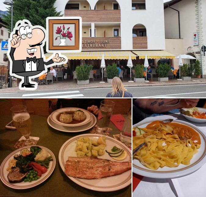 Siediti a un tavolo di Gasthof Toni