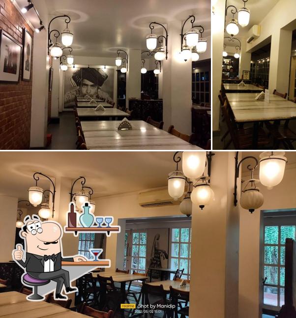 Take a seat at one of the tables at Amdavadi Gujarati Snack House