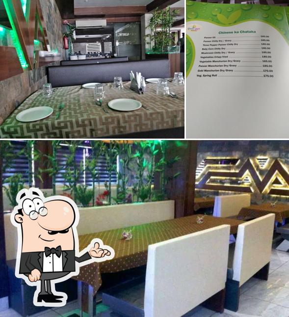 Take a seat at one of the tables at Green Apple Restaurant