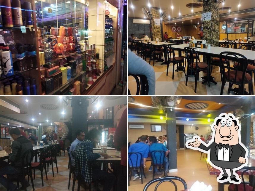 Take a seat at one of the tables at Royal Firdous Restaurant Since 1979(Aerodrome circle)
