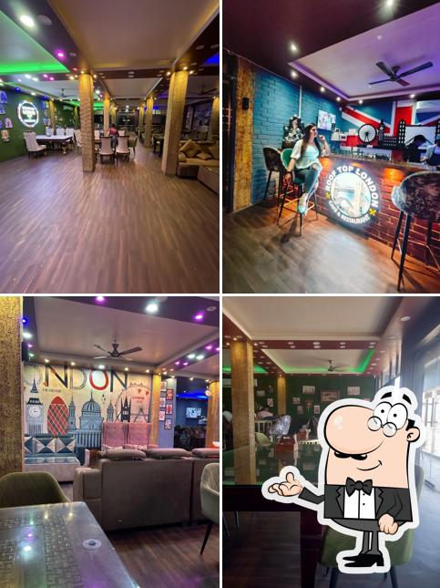 Take a seat at one of the tables at ROOFTOP LONDON CAFE & RESTAURANT