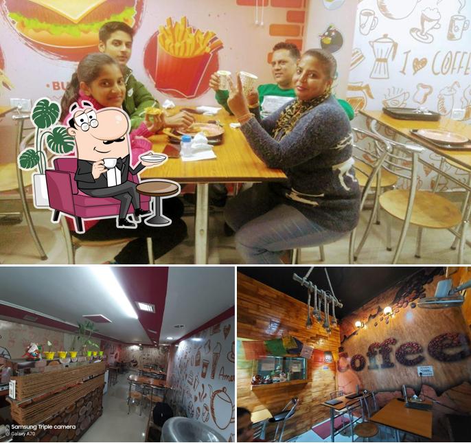 Take a seat at one of the tables at Hungry Bird Cafe Rishikesh