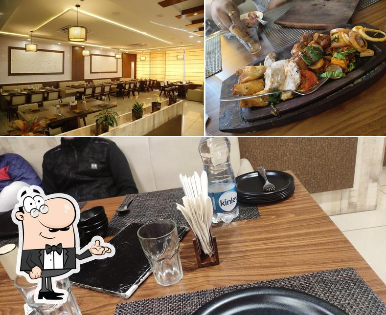 Take a look at the image displaying interior and food at The Phoenix Restro Bar & Lounge