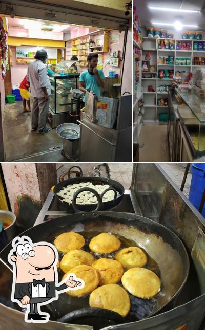 The picture of interior and food at Poonam Kheteshwar Sweet & Chats