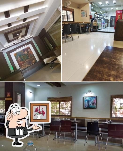 Take a seat at one of the tables at Hotel Krishnasagar