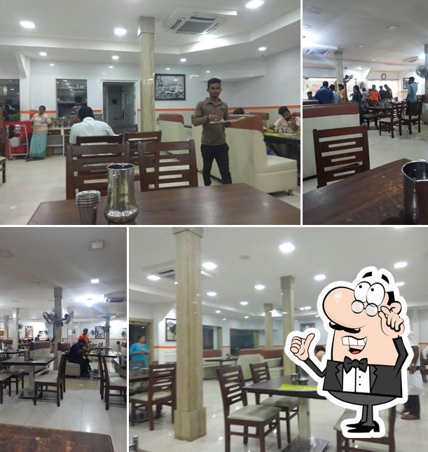 Take a seat at one of the tables at Ramana Mess