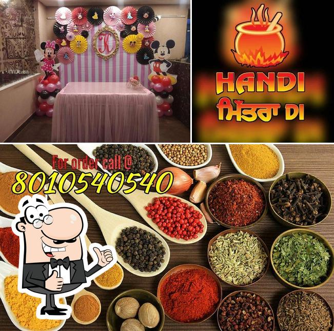 Look at the picture of Handi Mittra Di