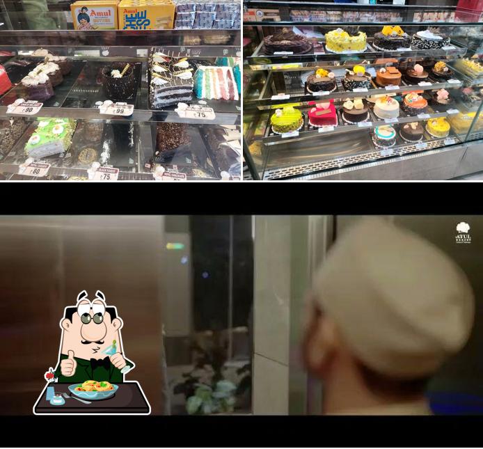 Check out the image showing food and interior at Atul Bakery Sama Vadodara