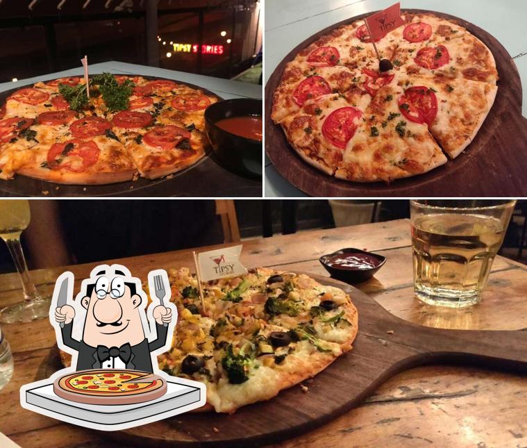 Order pizza at Tipsy Stories - Bar & Kitchen