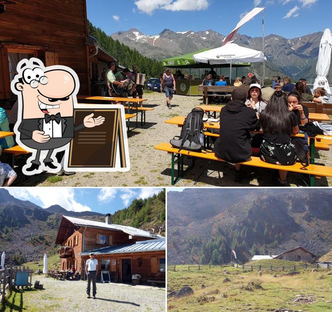 Puoi goderti l'aria fresca da seduto all'esterno di Malga del Convento
