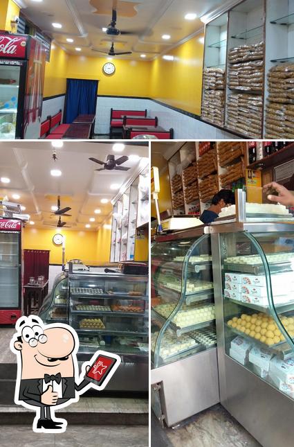 Look at this photo of MADHU SWEETS