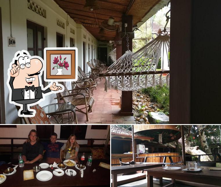 Take a seat at one of the tables at Avocado Garden Restaurant