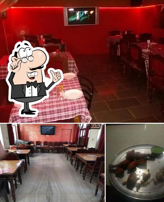 This is the picture depicting interior and food at Masala World Restaurant