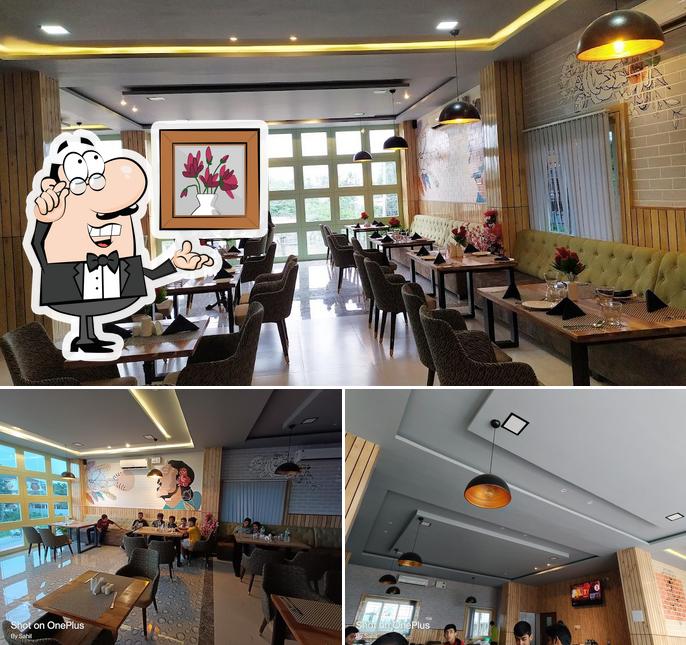 Take a seat at one of the tables at Sona Restaurant