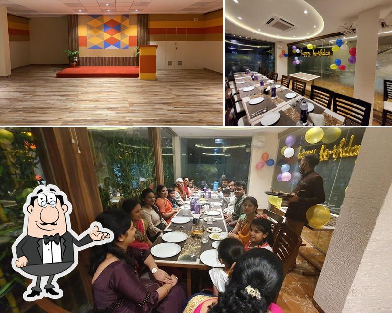 This is the picture depicting interior and dining table at Green Court Restaurant (Hotel Crystal Inn)