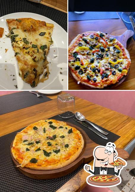 Try out pizza at HK's woodfire Pizza Pizza Cafe in Navsari