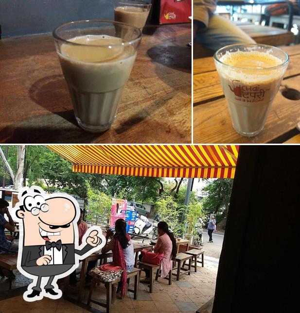 Take a seat at one of the tables at Chai Tapri Coffee Plaza