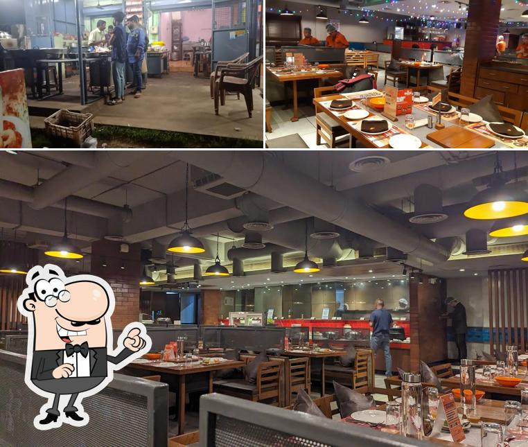 Take a seat at one of the tables at Barbeque Nation