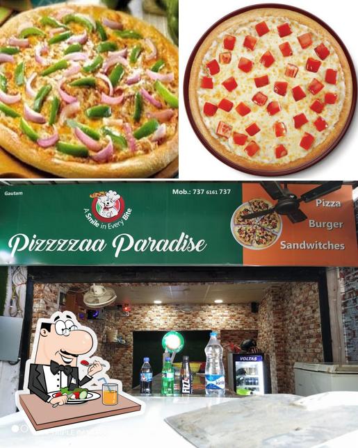 Check out the picture depicting food and interior at pizzzzaa paradise