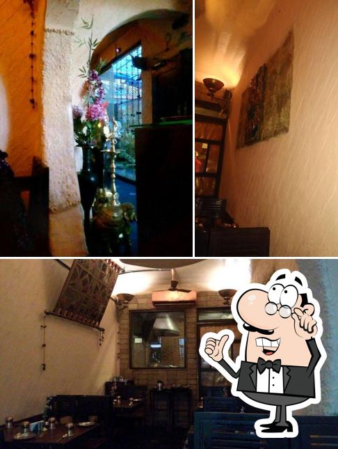 Take a seat at one of the tables at Taaareef Restaurant