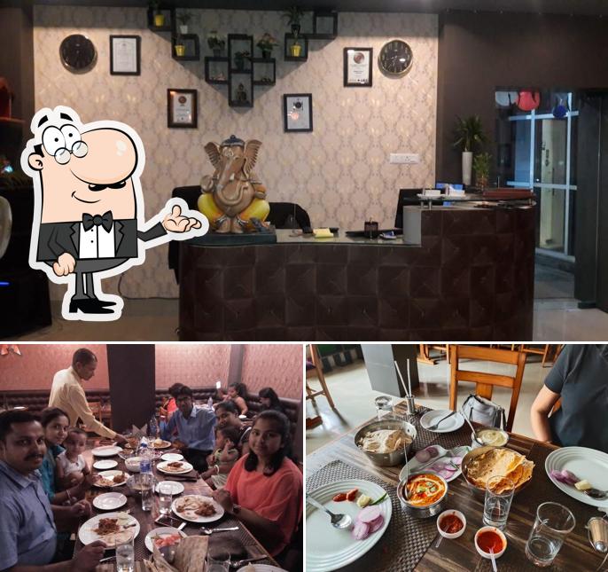 Take a seat at one of the tables at Moti Mahal Restaurant