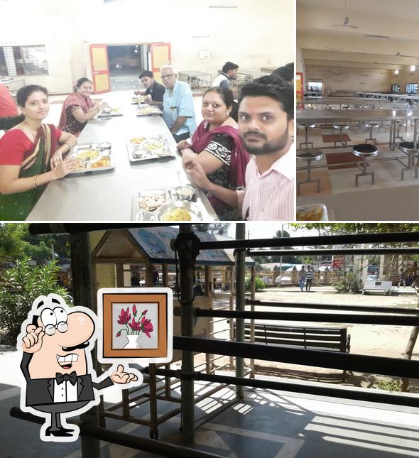Among various things one can find interior and dining table at Shri Bahuchar Bhojanalay
