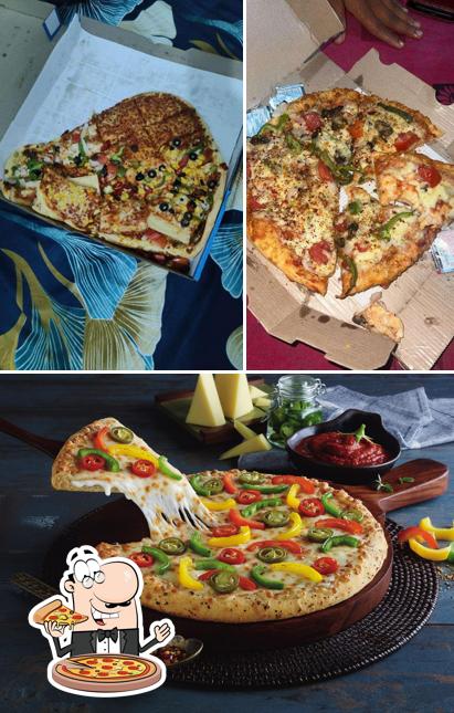 Try out pizza at Domino's Pizza