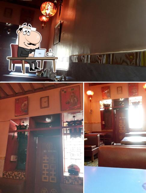 Take a seat at one of the tables at Shanghai Chinese Food Restaurant