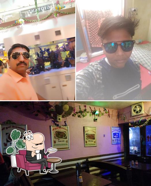 The photo of interior and dining table at maa durga bhojnalaya
