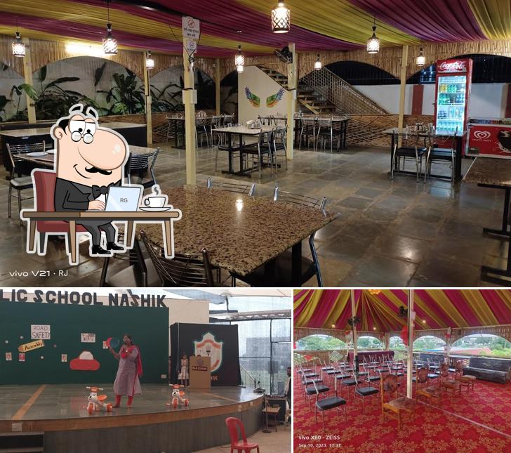 Take a seat at one of the tables at Hotel Tarangana