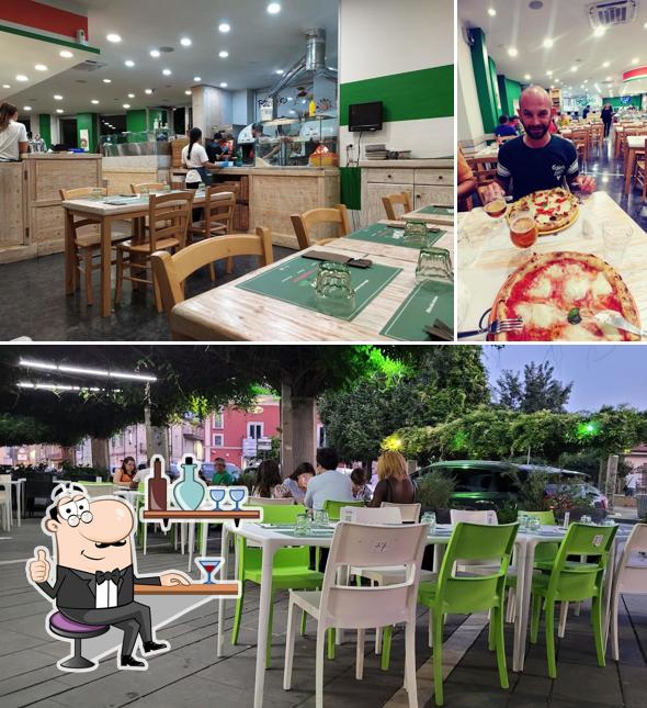 Tra le diverse cose da Pizzeria Basilico si possono trovare la interni e tavolo da pranzo