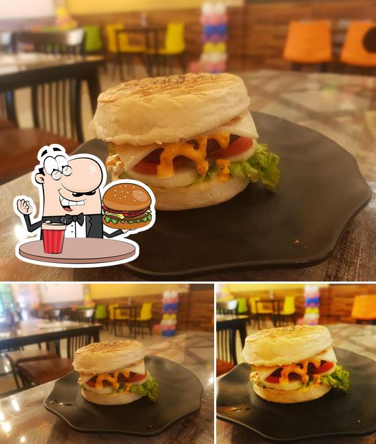 Order a burger at Urban Village Cafe