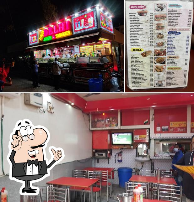 Take a seat at one of the tables at Rupam Fast Food