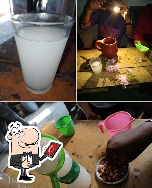 Look at the photo of Toddy Shop