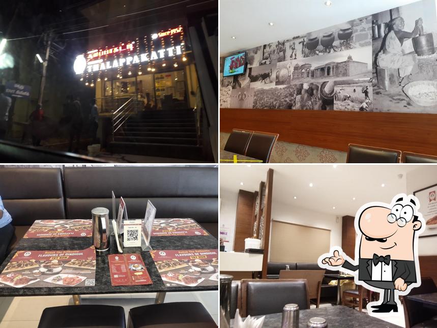 Take a seat at one of the tables at Dindigul Thalappakatti Restaurant