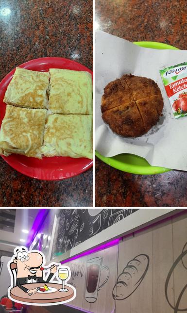 This is the picture displaying food and blackboard at Indian bakes